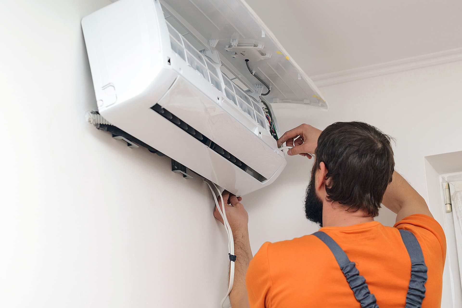 HVAC technician installs a home air conditioner in Las Vegas